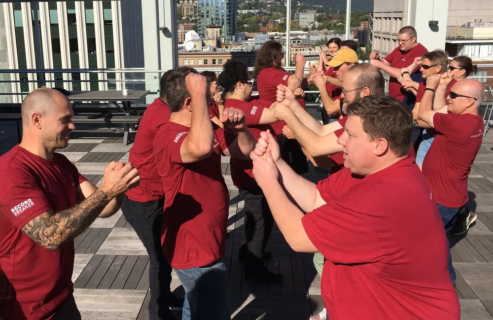CSz Portland facilitators leading a workshop on a rooftop venue