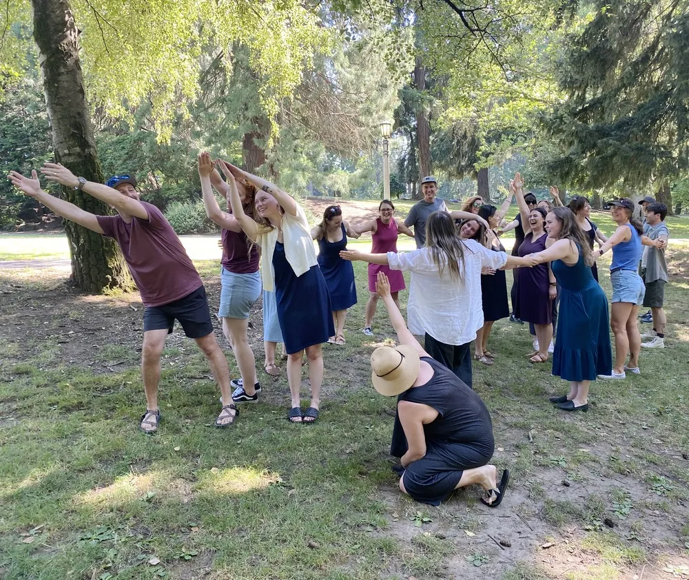 Team enjoying an outdoor team building activity in a Portland park setting
